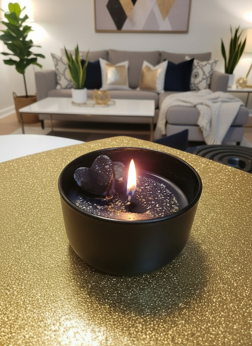 Black ceramic bowl with speckled pattern on a wooden surface